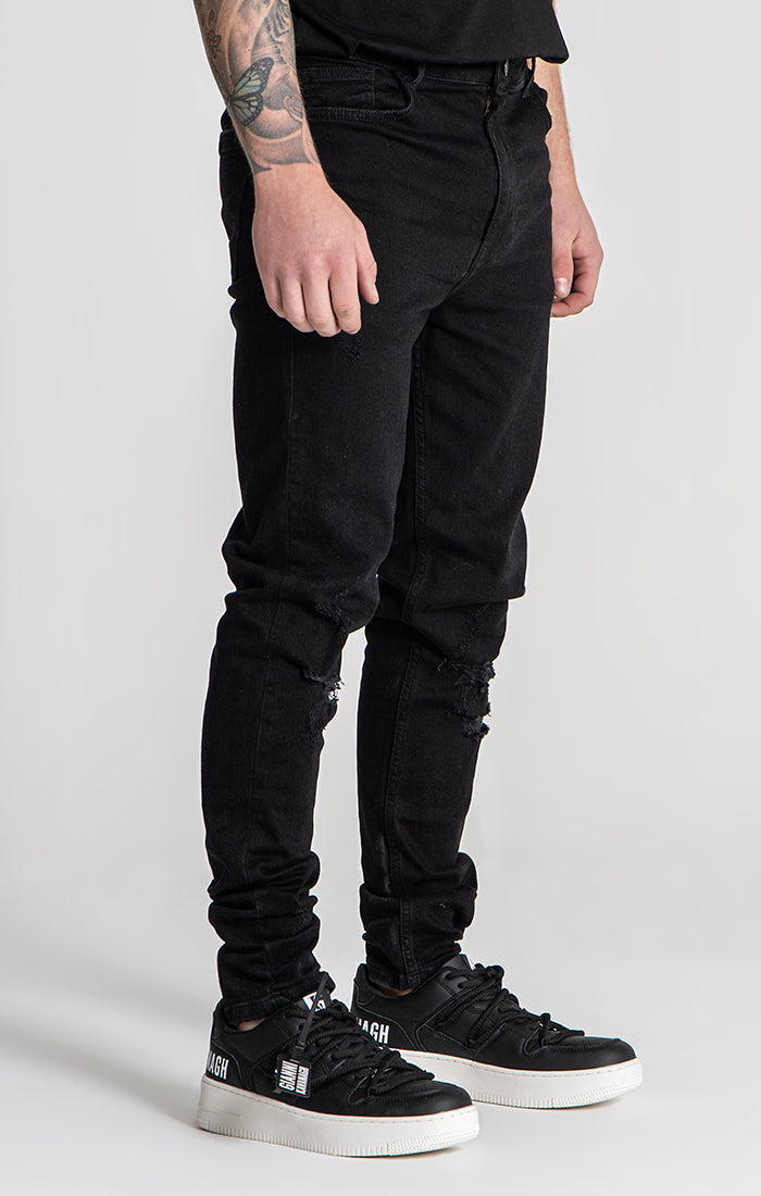 http://www.giannikavanagh.com/cdn/shop/files/Black-Core-Ripped-Slim-Fit-Jeans-1.jpg?v=1708970216